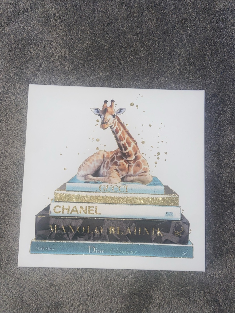 Giraffe Sitting on Luxury Fashion Books Canvas Art - Blue & Gold Accents